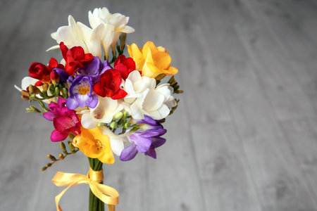 beautiful freesia bouquet on blurred backgroundの写真素材