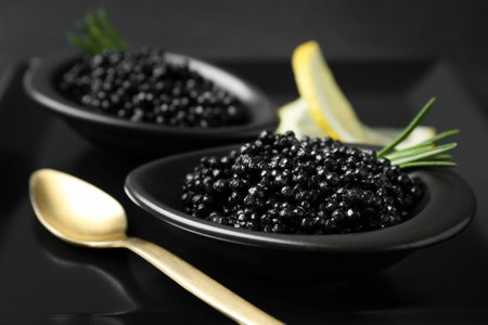 Bowls with black caviar on plate, closeupの写真素材