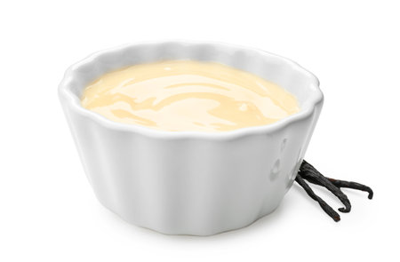 Bowl with vanilla pudding on white backgroundの写真素材