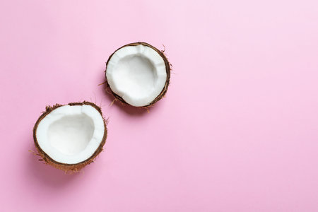 Coconut halves on color backgroundの写真素材