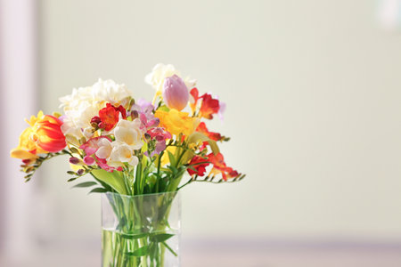 Beautiful bouquet of freesia flowers on blurred backgroundの写真素材