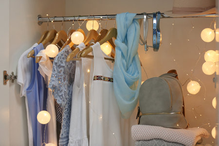 Women clothing on hangers in wardrobeの写真素材