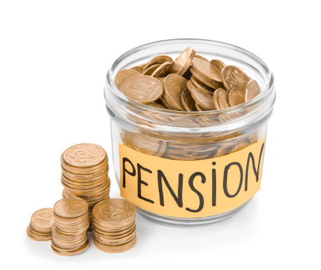 Glass jar with label "PENSION" and coins on white backgroundの写真素材