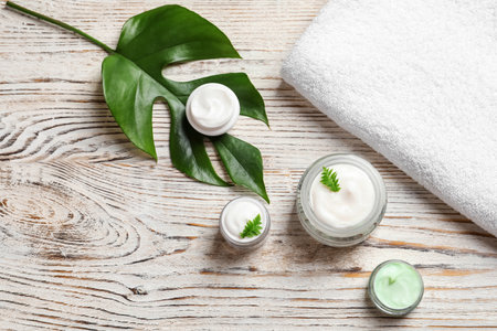 Flat lay composition with cosmetic products on wooden backgroundの写真素材