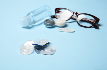 Contact lenses, glasses and accessories on color backgroundの写真素材