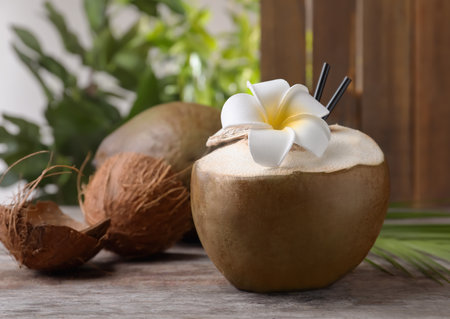 Fresh green coconut on wooden tableの写真素材