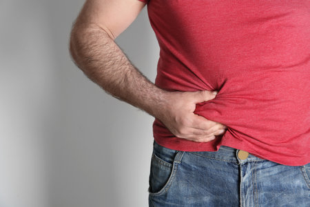 overweight man on white backgroundの写真素材