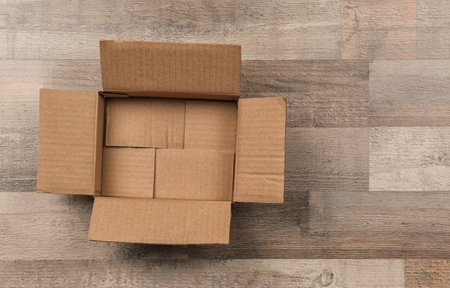 Cardboard box on wooden floor
