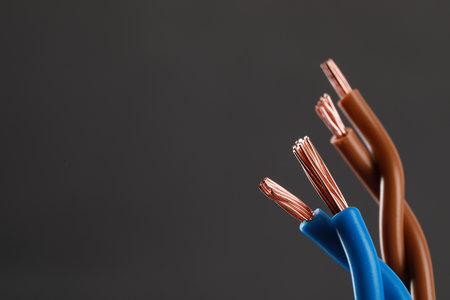 New colorful electrical wires on gray background, space for textの写真素材