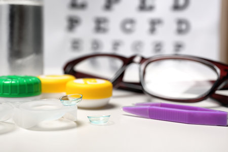 Contact lenses and tweezers on table, closeupの写真素材