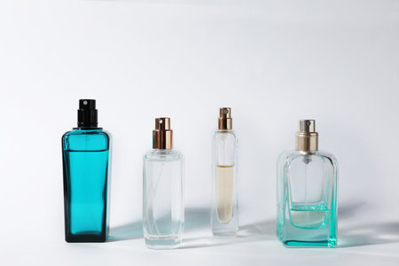 bottles of perfume on light background