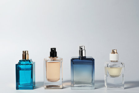 bottles of perfume on light backgroundの写真素材
