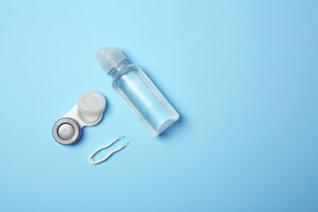Flat lay composition with contact lens accessories on color backgroundの写真素材