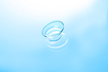 contact lens on color glass backgroundの写真素材