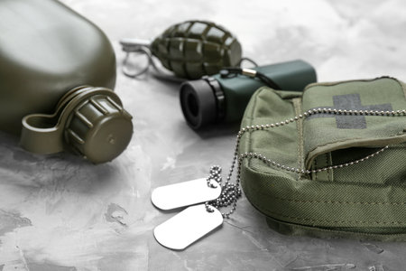 Set of military outfit on gray backgroundの写真素材