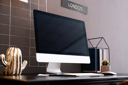 Comfortable workplace with computer on desk in home office