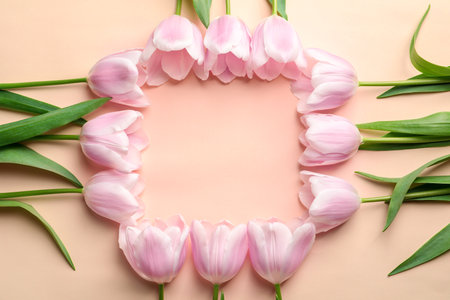 Beautiful frame made of tulips for Mother's Day on color backgroundの写真素材