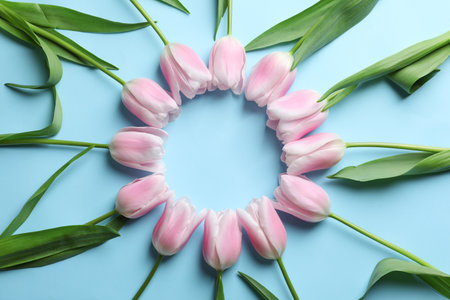 Beautiful frame made of tulips for Mother's Day on color backgroundの写真素材