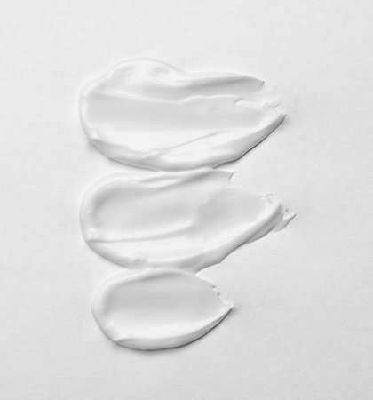 Cream smears on white background. cosmetic product