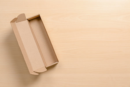 Cardboard box on wooden background