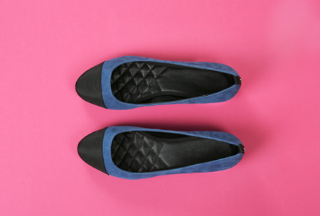 Pair of female shoes on color background, top viewの写真素材