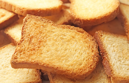 Toasted slices of bread as background, closeupの写真素材