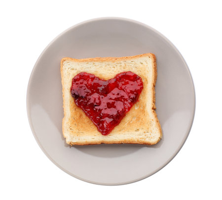 Toast with jam on plate, isolated on whiteの写真素材