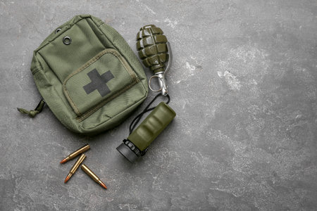 Set of military outfit on gray backgroundの写真素材
