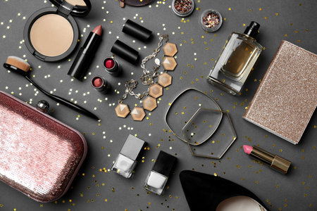 Flat lay composition with cosmetics and accessories on gray backgroundの写真素材