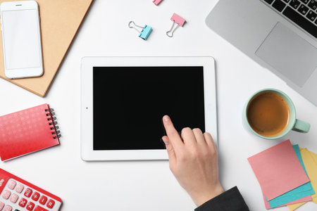 Woman with tablet computer on white background. business trainer conceptの写真素材
