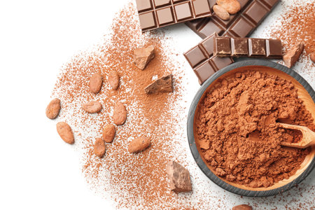 Flat lay composition with cocoa powder, beans and chocolate on light backgroundの写真素材