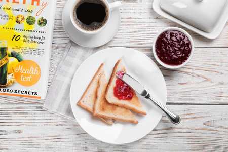Toasts with sweet jam on wooden background, flat lay compositionの写真素材