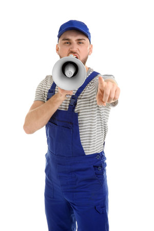 Male worker shouting into megaphone on white backgroundの写真素材