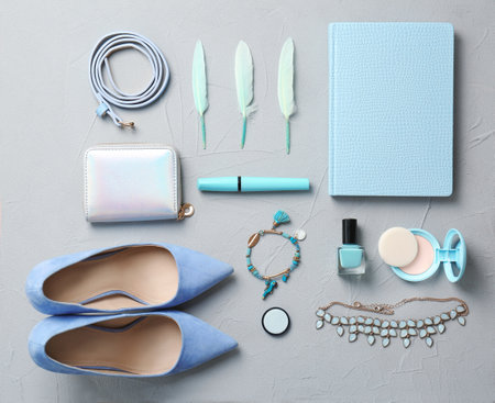 Set of accessories, cosmetics and shoes on gray background, flat layの写真素材
