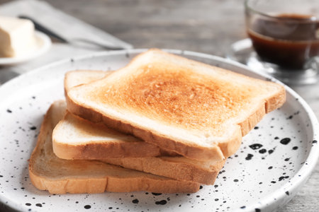 Plate with toasted bread on table, closeupの写真素材