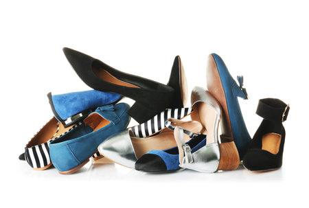 Many different female shoes on white backgroundの写真素材