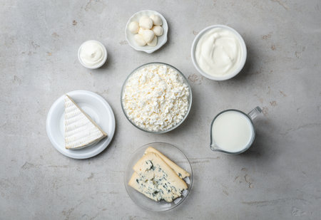 Flat lay composition with fresh dairy products on gray background