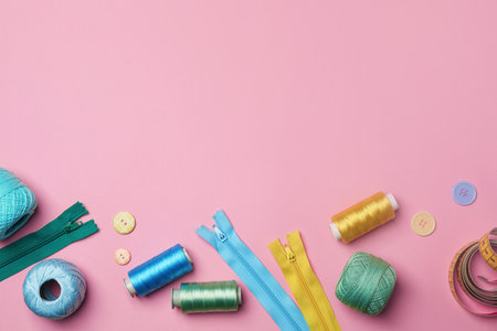 Flat lay composition with sewing threads on color backgroundの写真素材