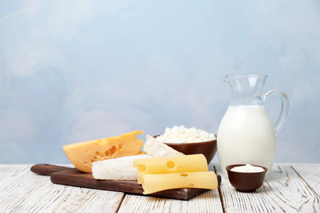 Different dairy products on wooden tableの写真素材