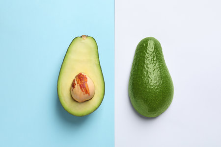 Flat lay composition with fresh avocado on color backgroundの写真素材
