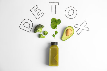 Flat lay composition with word DETOX, healthy smoothies and ingredients on light backgroundの写真素材