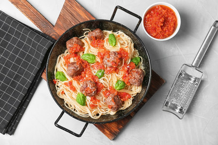 Pasta with meatballs and tomato sauce on gray backgroundの写真素材