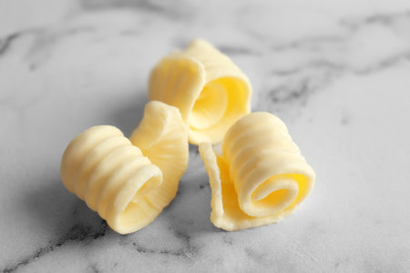 Fresh butter curls on table, closeupの写真素材