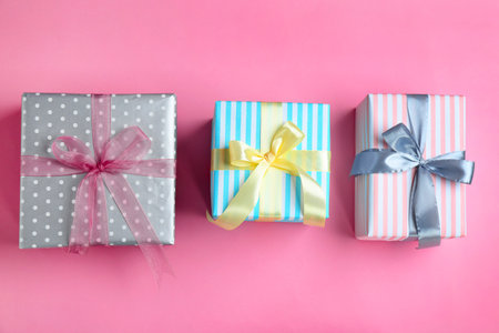 Different gift boxes on color background, flat layの写真素材