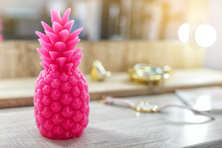 Pineapple shaped candle on tableの写真素材