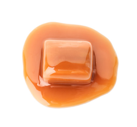 Delicious candy with caramel sauce on white backgroundの写真素材