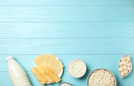 Flat lay composition with different dairy products on wooden backgroundの写真素材
