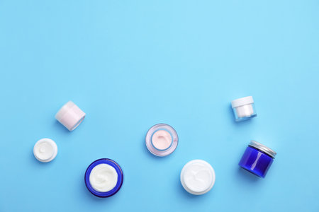 Flat lay composition with cosmetic products on color backgroundの写真素材