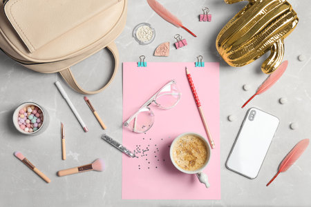 Set of accessories, cosmetics, coffee and mobile phone on gray background, flat lay