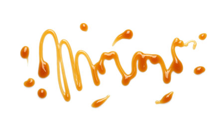 Delicious caramel sauce on white backgroundの写真素材
